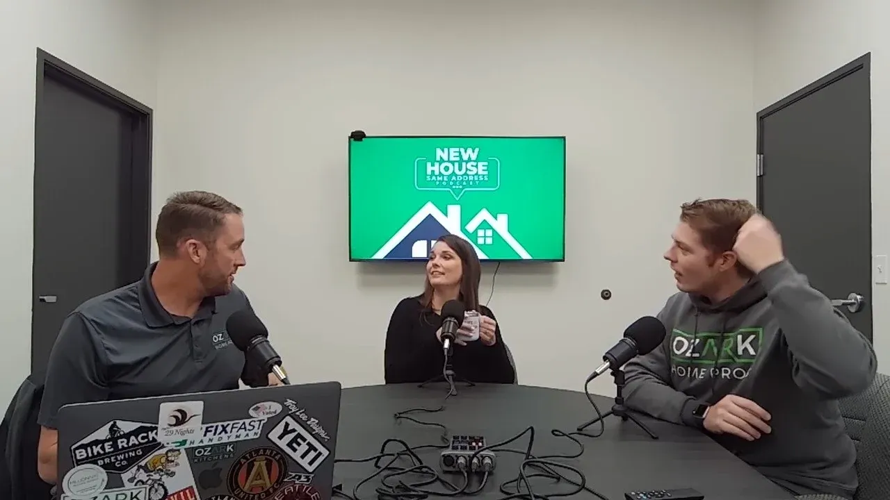 The Founder of Twist & Spout, Eric Barker, and his wife Charis, sitting with a manager at a black table discussing home improvement and remodeling topics for their ‘New House, Same Address’ podcast.