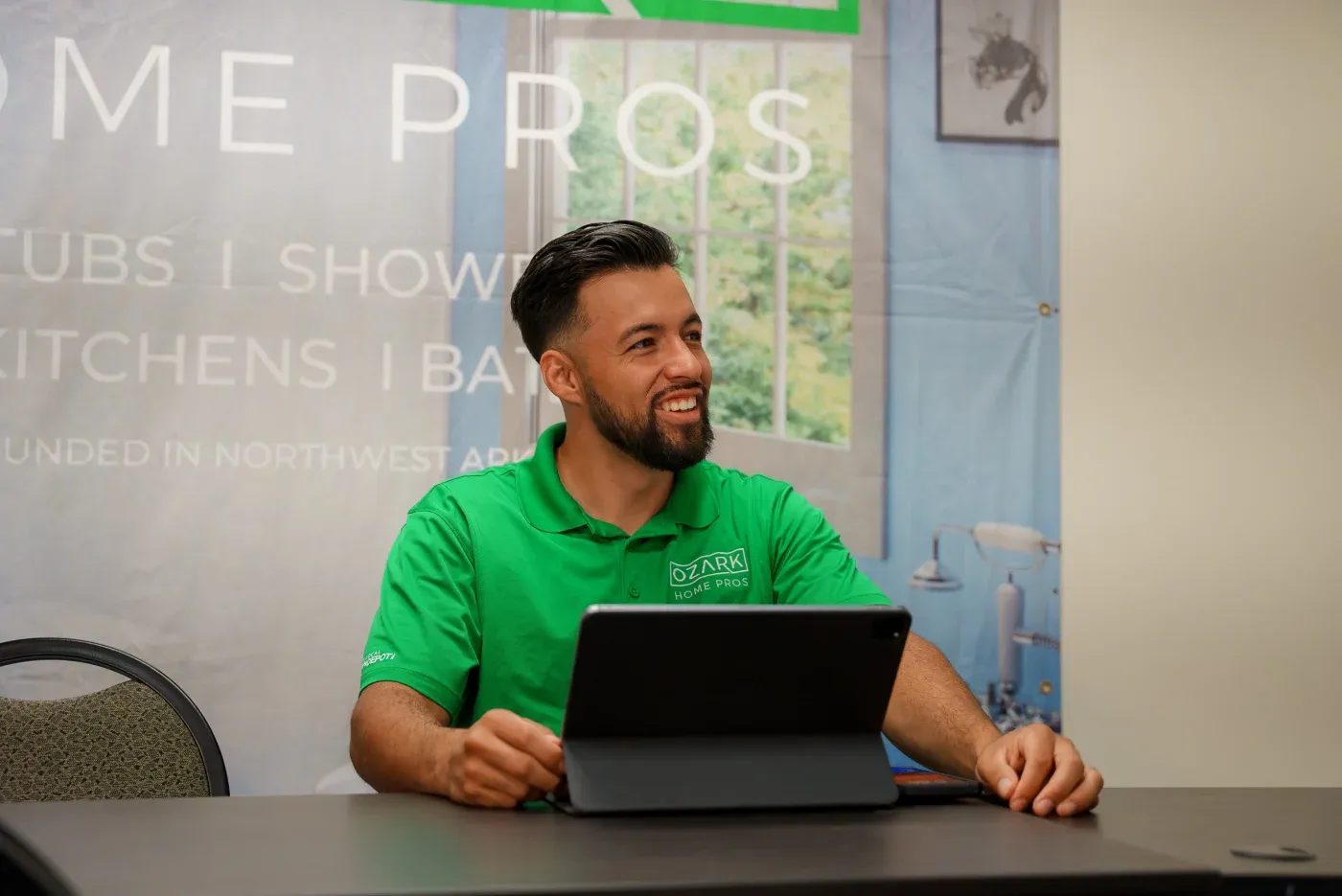 The Founder & CEO of Twist & Spout, Eric Parker, demonstrating to a homeowner how one of their high-quality replacement windows functions wearing a great company t-shirt.